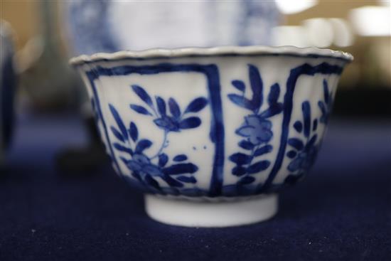 A Chinese blue and white tea bowl and saucer and two jars, Kangxi, some damage, largest diameter 11cm